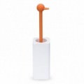 Toilet-brush holder for the floor with a brush handle shaped like an duck in white and orange.